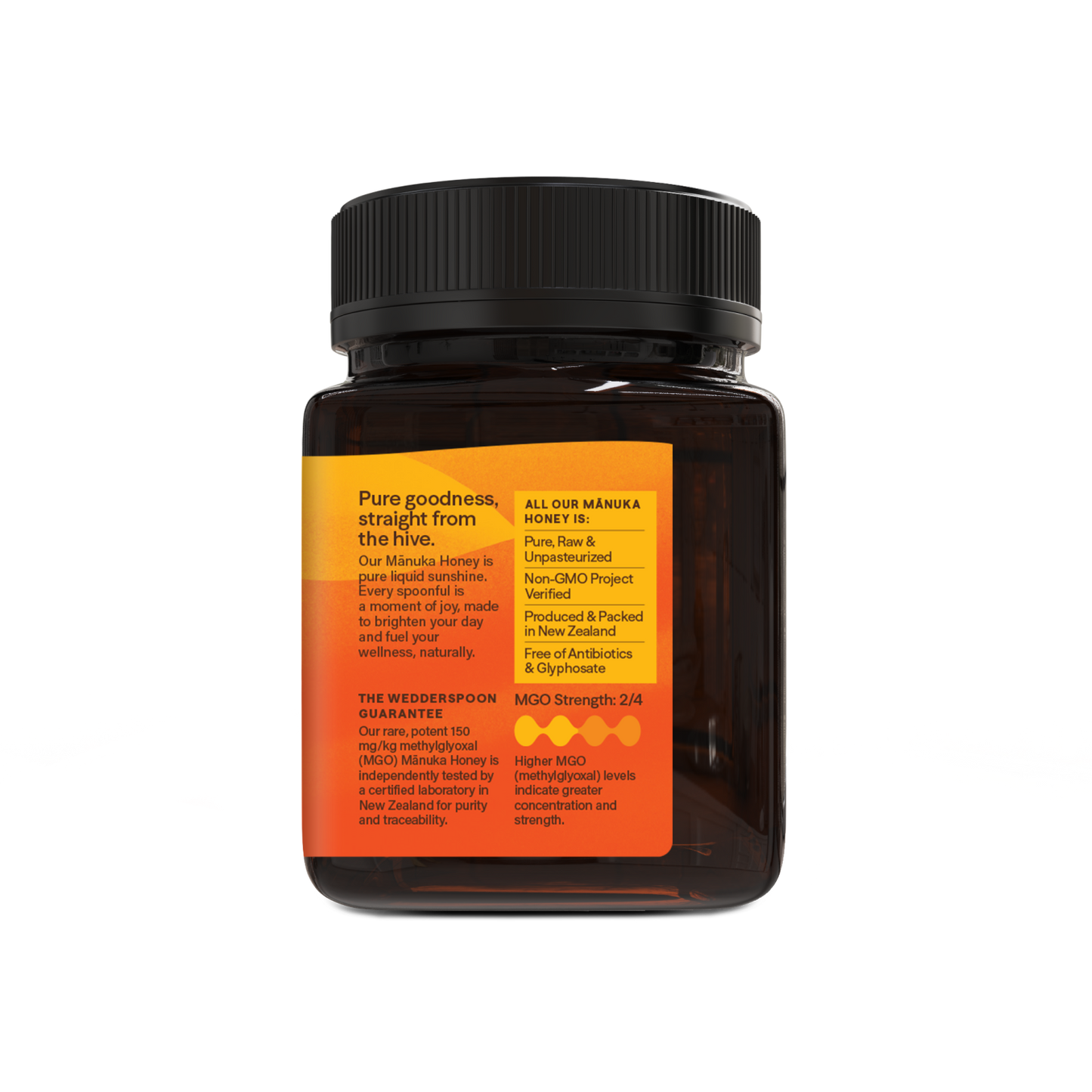 Jar of honey with a black lid and orange label on a white background