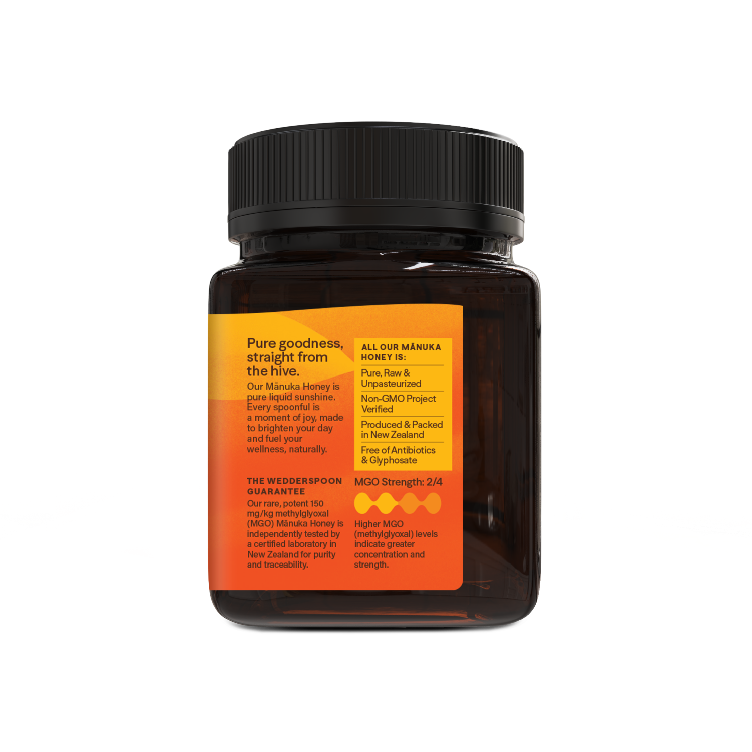 Jar of honey with a black lid and orange label on a white background